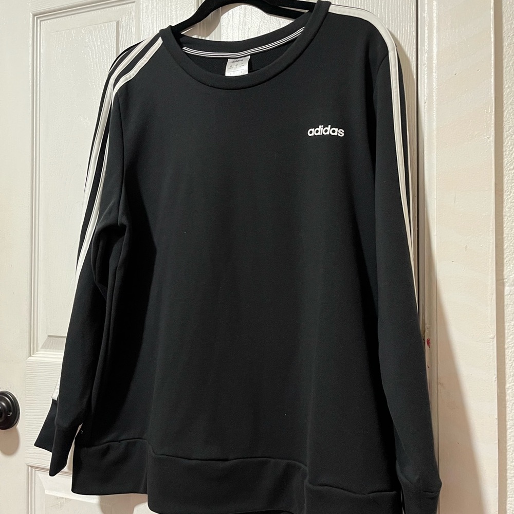 A black long sleeve crew neck Adidas sweater. Brand new worn only a few times.